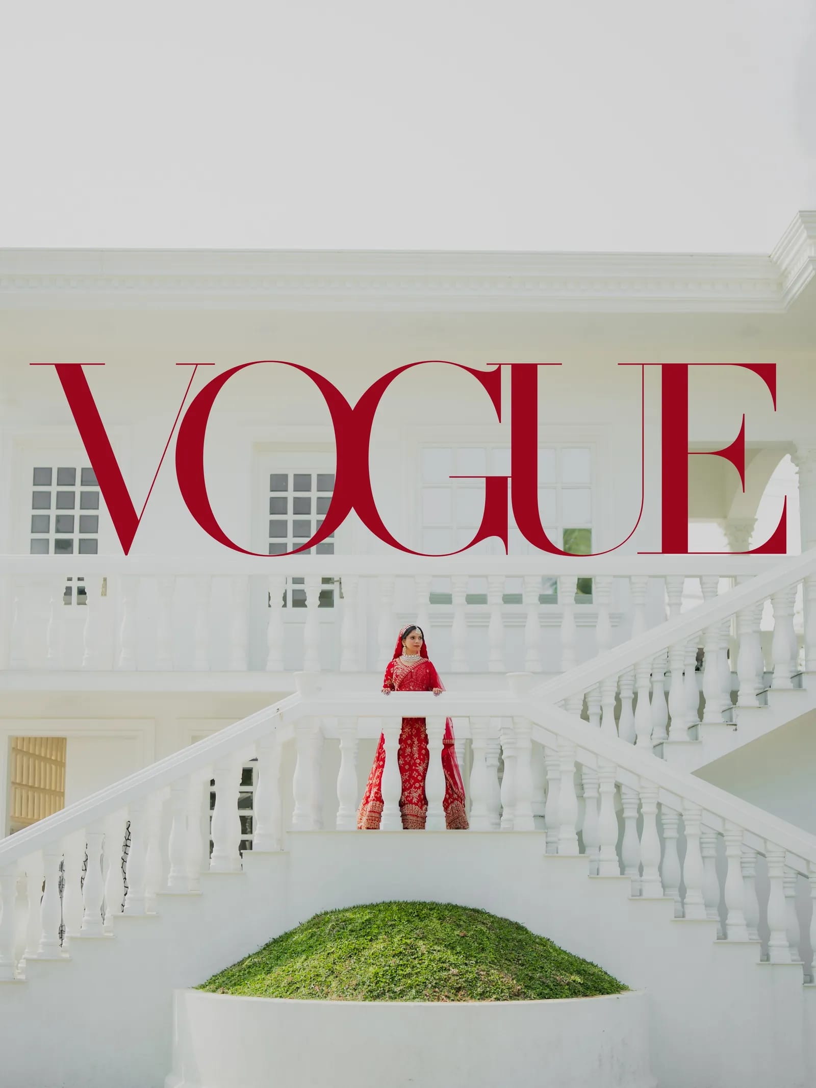 Bride in red on the staircase of a white building in an editorial composition