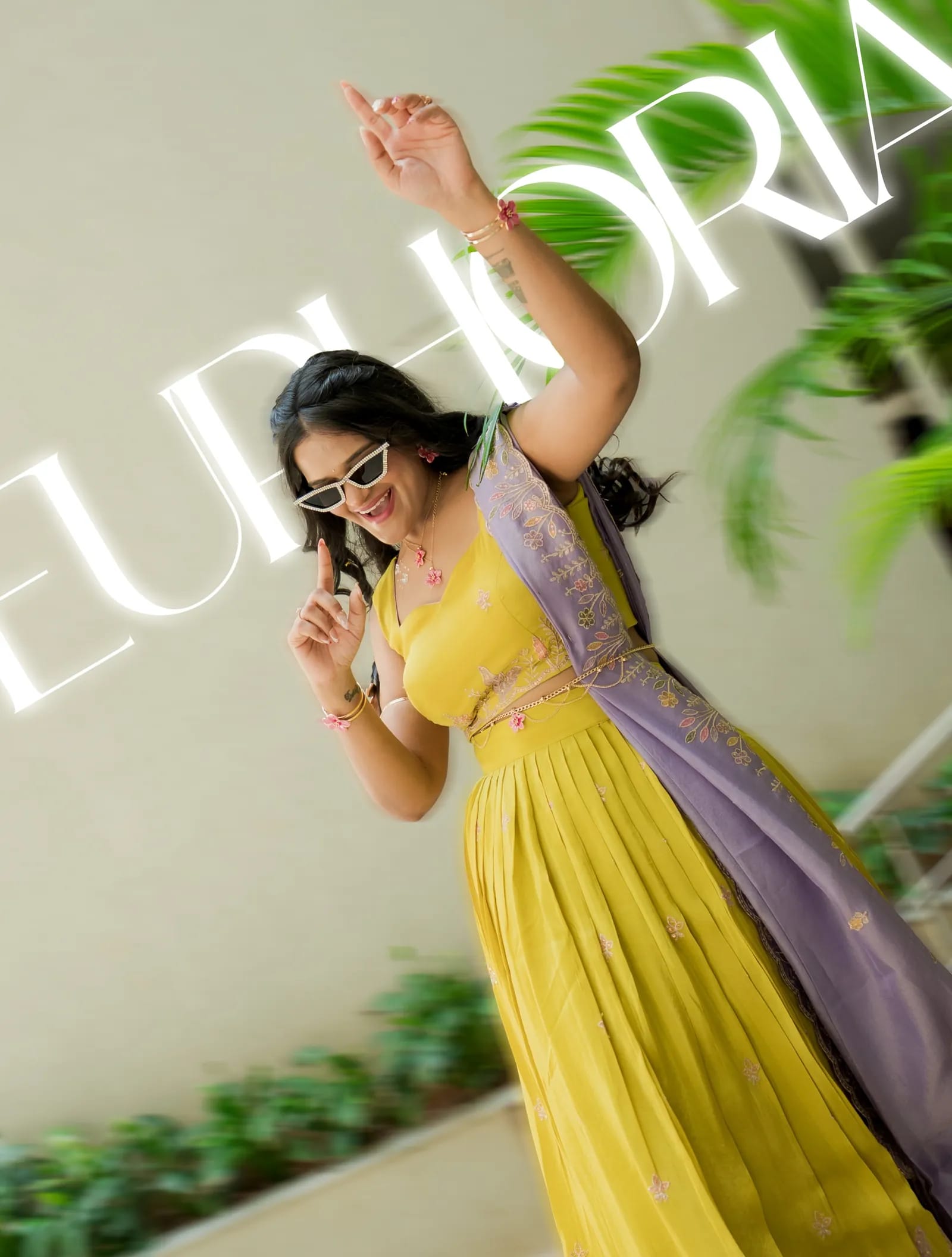 Joyful bride in yellow celebrating her wedding festivities